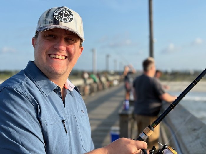 John fishing off a pier
